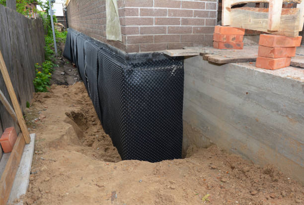SJ Waterproofing Pros technician performing targeted Waterproofing assessment in Meridianville, AL
